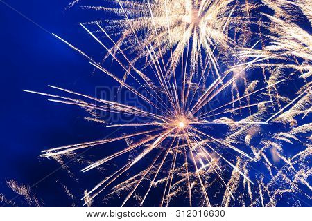 Inexpensive Fireworks Over The City Yellow, Blue And White. Bright And Shiny.  For Any Purpose. Cele