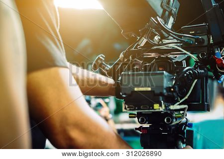 Behind The Scene. Cameraman Shooting Film Scene With Camera