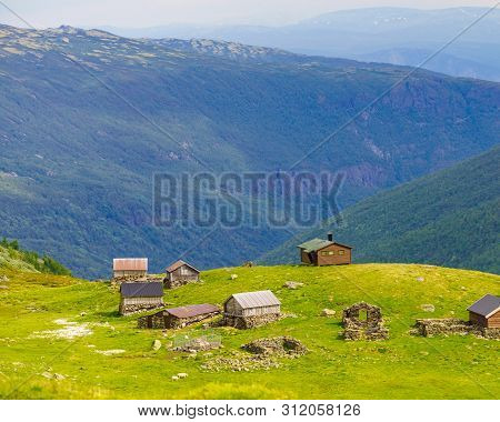 Norwegian Old Houses Hytte, Mountains Farm. Summer Landscape In Norway, Scandinavia