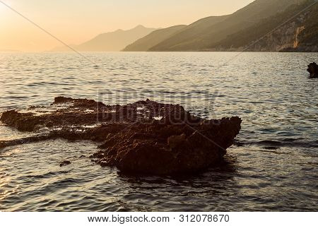 Beautiful Sunset With Rocks In The Adriatic Sea, Dingac Borak, Dalmatia, Croatia, Peljesac Peninsula