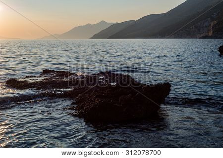 Beautiful Sunset With Rocks In The Adriatic Sea, Dingac Borak, Dalmatia, Croatia, Peljesac Peninsula