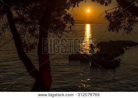 Beautiful Sunset With Trees And Rocks In Dingac Borak, Dalmatia, Croatia, Peljesac Peninsula
