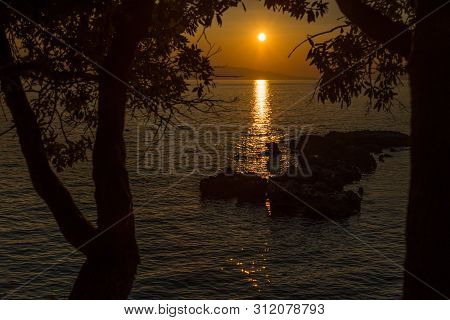 Beautiful Sunset With Trees And Rocks In Dingac Borak, Dalmatia, Croatia, Peljesac Peninsula