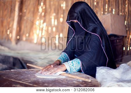 Arab Woman Makes Bread In The Beduin Village In Egypt
