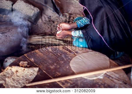 Arab Woman Makes Bread In The Beduin Village In Egypt
