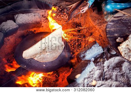 Arab Woman Makes Bread In The Beduin Village In Egypt