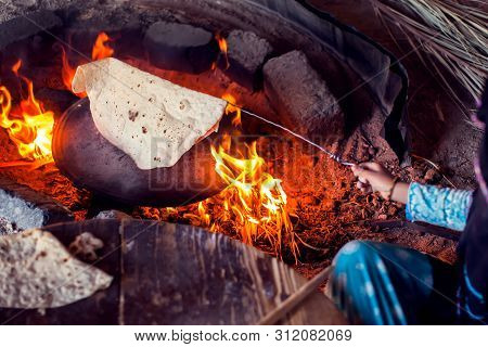 Arab Woman Makes Bread In The Beduin Village In Egypt.