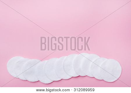 Cotton Round Swabs On A Pink Background. Selective Focus Copy Space.