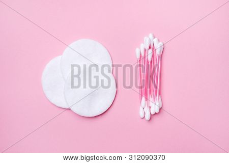 Pink Cotton Buds And Cotton Swabs On Pink Background. Selective Focus Copy Space.