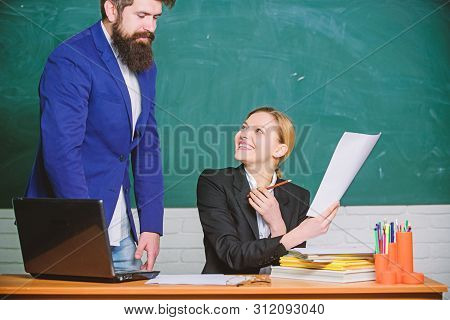 Digital World. Teacher And Student On Exam. Business Couple Use Laptop And Documents. Paper Work. Of