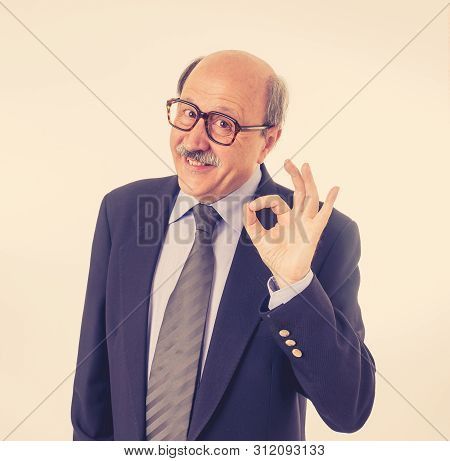 Portrait Of Last Day At Work Of Happy Senior Businessman Excited About His Retirement