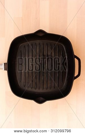 Fat-less Pan On Wooden Background, Top View