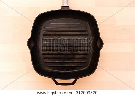 Fat-less Pan On Wooden Background, Top View