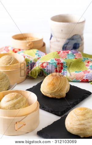 Oriental Food Concept Homemade Organic Huaiyang Spiral Chinese Flaky  Pastry Moon Cake On White Back