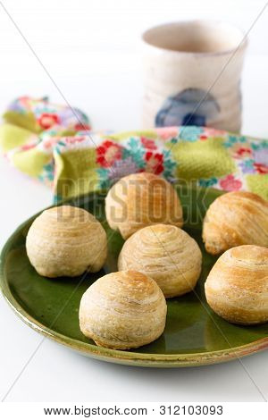 Oriental Food Concept Homemade Organic Huaiyang Spiral Chinese Flaky  Pastry Moon Cake On White Back