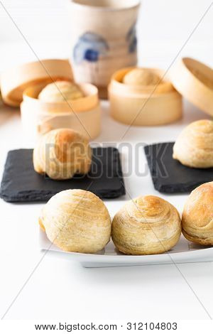 Oriental Food Concept Homemade Organic Huaiyang Spiral Chinese Flaky  Pastry Moon Cake On White Back