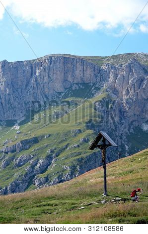 Wooden Crucifix In A Meadow Mountain Dolomiti