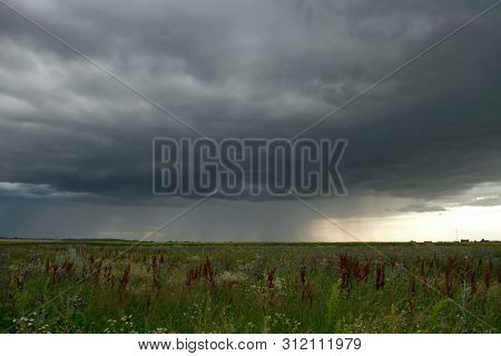 Beautiful storm sky with clouds and field, apocalypse, tunder, tornado
