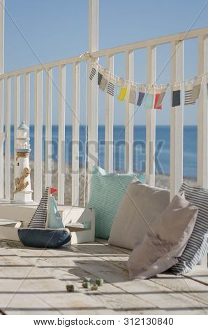 Omposition With Beach Decoration Shells, Boat And Lighthouse, With Pillowson Wave Ocean Background, 
