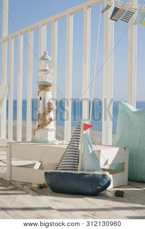 Omposition With Beach Decoration Shells, Boat And Lighthouse, With Pillowson Wave Ocean Background, 