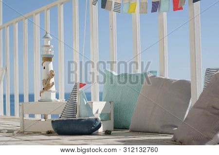 Omposition With Beach Decoration Shells, Boat And Lighthouse, With Pillowson Wave Ocean Background, 