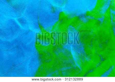 Mixed Blue-green Flat Plasticine Texture With Distinct Fingerprints. Small Dust Particles On Surface