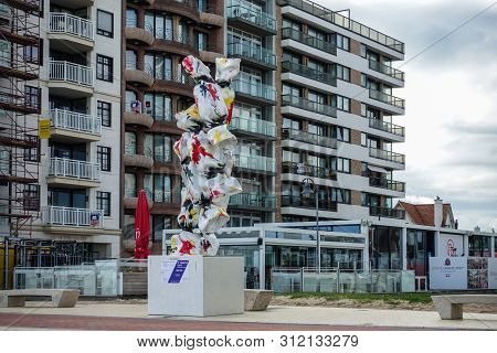 Knokke-heist, Flanders, Belgium -  June 16, 2019: Knokke-zoute Part Of Town. Statue Of Six Wrapped C