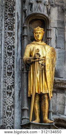 Bruges, Flanders, Belgium -  June 17, 2019: Detail With Golden Noblity Statue Of Facade Of Basilica 