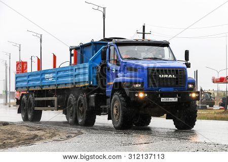 Novyy Urengoy, Russia - June 21, 2019: Semitrailer Offroad Truck Ural 44202 Next In The City Street.