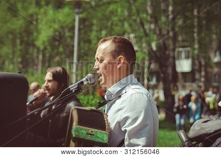 Russia, Siberia, Novokuznetsk - May 9, 2019: Musicians Sing Songs On The Street On Victory Day