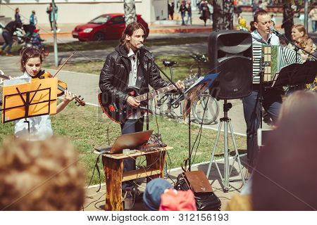 Russia, Siberia, Novokuznetsk - May 9, 2019: Musicians Sing Songs On The Street On Victory Day