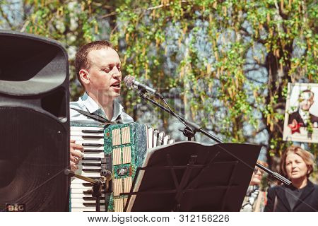 Russia, Siberia, Novokuznetsk - May 9, 2019: Musicians Sing Songs On The Street On Victory Day