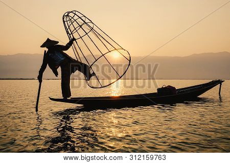 Man Catching Fish On Inle Lake (shan State)