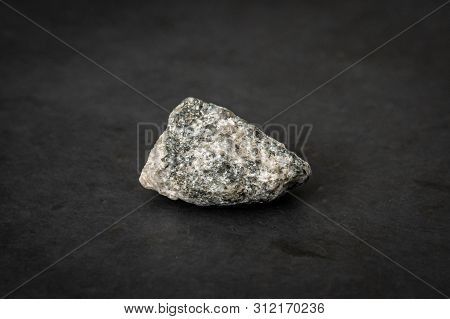 Small Piece Of The Hardest Kind Of Granite Bed Rock With Its Typical Texture And Color