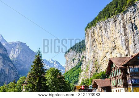 Beautiful Staubbach Falls In Picturesque Village Lauterbrunnen, Switzerland Photographed In Summer S