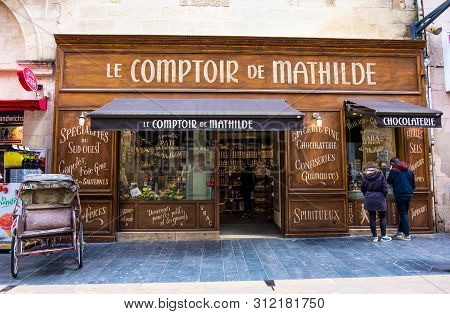 Bordeaux, France - May 5, 2019 : A Couple Of Young People Near The Storefront Le Comptoir De Mathild