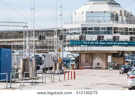 Cars And Passengers Waiting For Driving Onto The Ferry In The Port Of Helsingborg, Sweden, June 16, 