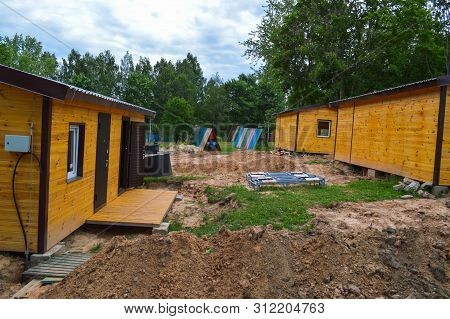 Construction Of Small Yellow Wooden Frame Prefabricated Pre-fabricated Eco-house Of Suburban Modular