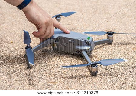 Male Hand Presses The Button To Launch The Drone For Flight, Close-up
