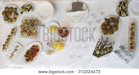 Food For A Buffet On The Table Top View. Snacks. A Festive Table With Dishes And Drinks.