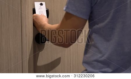 Closeup Hand Man Using An Electronic Security Key Card For Opens The Door Of His Hotel Room, Holiday
