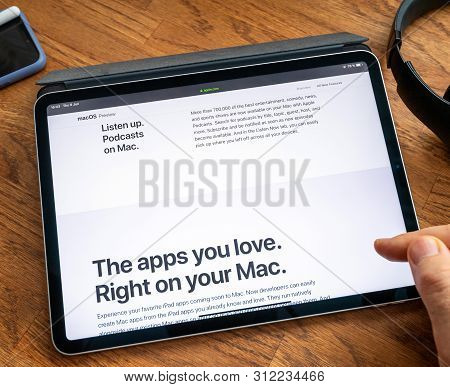 Paris, France - Jun 6, 2019: Man Reading On Apple Ipad Pro Tablet About Latest Announcement Of At Ap