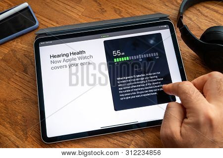 Paris, France - Jun 6, 2019: Man Reading On Apple Ipad Pro Tablet About Latest Announcement Of At Ap