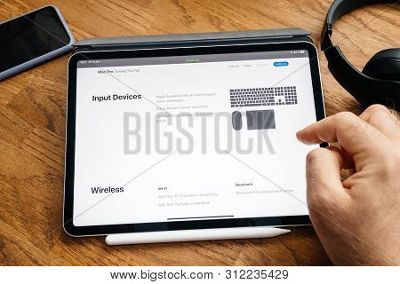 Paris, France - Jun 6, 2019: Man Reading On Apple Ipad Pro Tablet About Latest Announcement Of At De