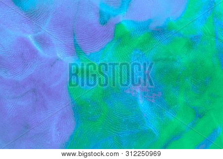 Mixed Purple-green Flat Plasticine Texture With Distinct Fingerprints. Small Dust Particles On Surfa