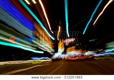 A View Through The Windshield While Driving At Night. Long Exposure. Artistic, Abstract.