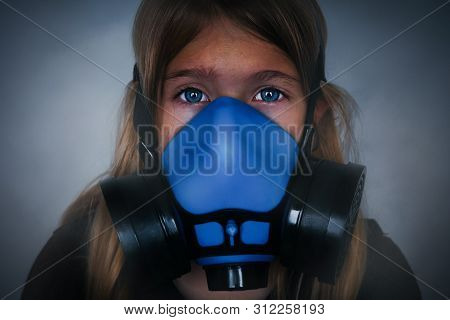 Young Girl Wearing Gasmask, Respirator Portrait. Effects Of Worldwide Air Pollution, Industrial Infl