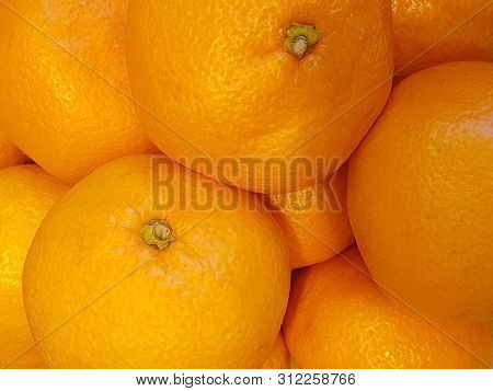 Fresh Orange Fruit Background In Close-up; Shoot By Mobile Camera.