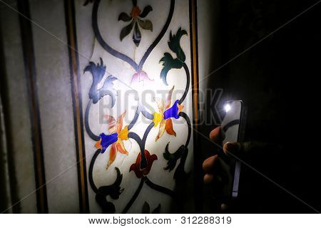 Tourist Shining Light On Pietra Dura (stone Inlay) Inside Taj Mahal, Agra, Uttar Pradesh, India. It 
