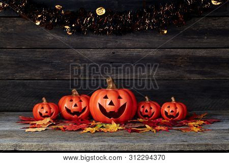 Halloween Pumpkin Lantern. Trick Or Treat On A Wooden Table